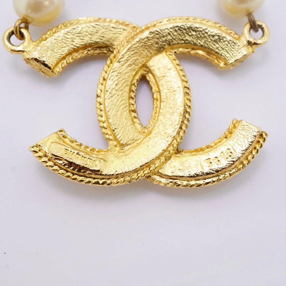 CHANEL Gold Pearl Logo Necklace - Picture 5 of 8